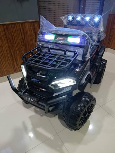 NH Toys model DLX-8188 kids' UTV ride-on jeep in black.