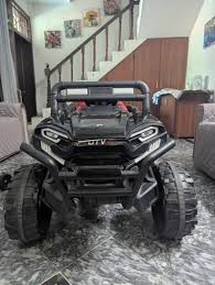 NH Toys model DLX-8188 kids' UTV ride-on jeep in black.